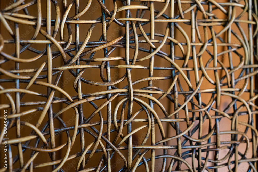 Fototapeta premium Close-Up of Decorative Woven Rattan Pattern with Abstract Interlacing Design
