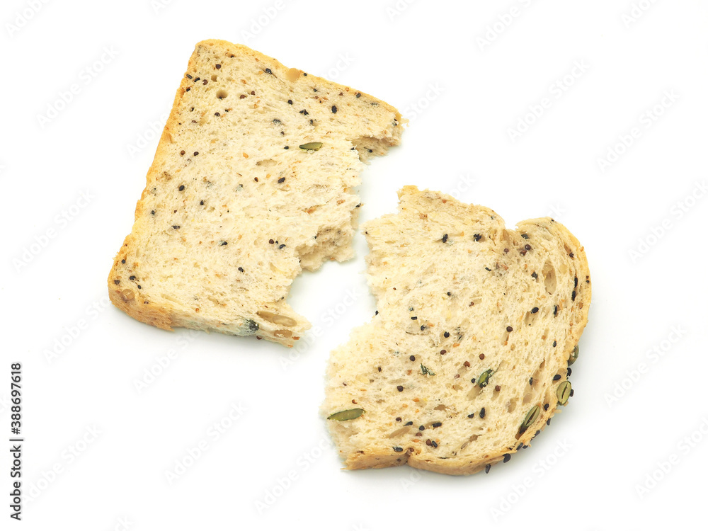 Top view fresh homemade slice of whole wheat bread broken into two halves, isolated on a white background.. Top view fresh homemade slice of whole wheat bread broken into two halves, isolated on a white background..