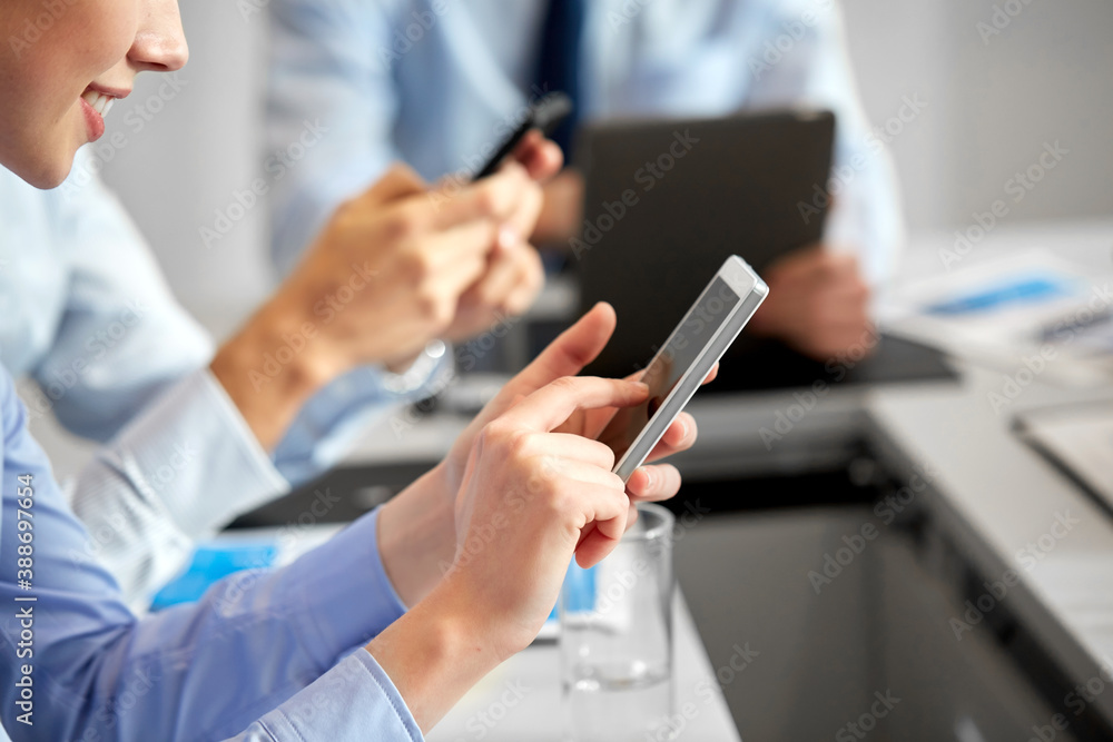 business, technology and people concept - close up of businesswoman using smartphone at office business, technology and people concept - close up of businesswoman using smartphone at office