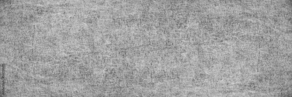 Fototapeta premium Black and white abstract background. Light gray texture of rough natural fabric. Denim texture. Wide web banner.