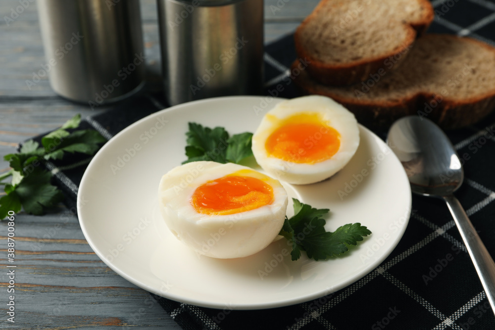 Concept of breakfast with boiled eggs on wooden background Concept of breakfast with boiled eggs on wooden background