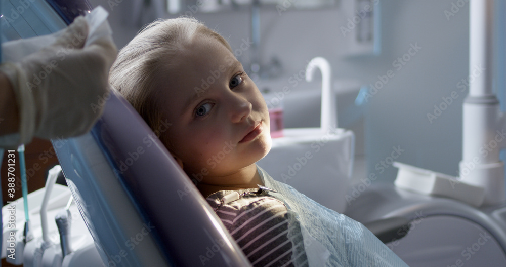 Calm little patient in dental chair Calm little patient in dental chair