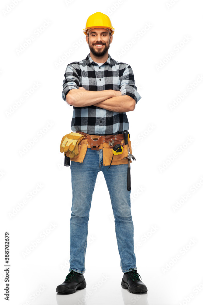 profession, construction and building - happy smiling male worker or builder in helmet with crossed arms over white background