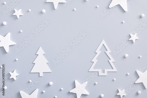 White star over pastel blue with white paper forest