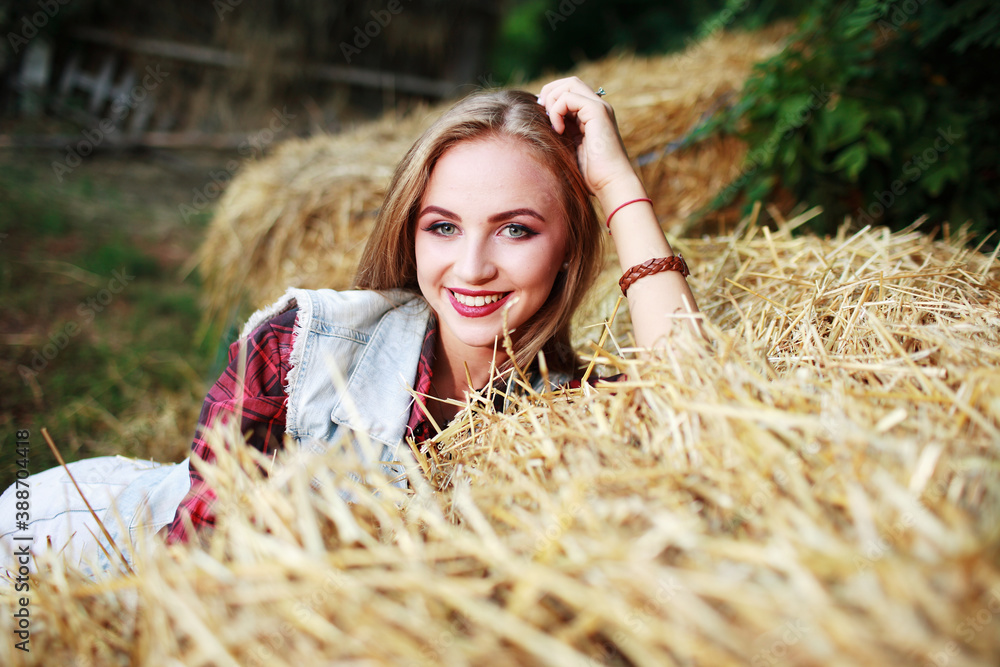 beautiful girl lies in a field on the hay beautiful girl lies in a field on the hay
