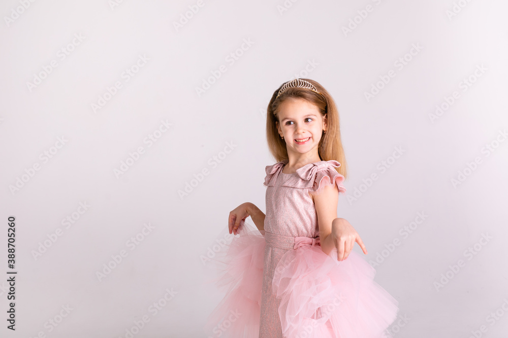 Beautiful little princess dancing in luxury pink dress Beautiful little princess dancing in luxury pink dress