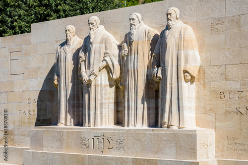 The four statues at the center of the Reformation Wall in the Parc des Bastions in Geneva, Switzerland, representing John Calvin and the Calvinism's main proponents, on a sunny summer day. photo