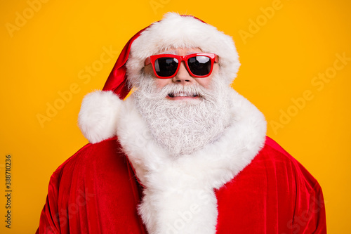 Close-up portrait of his he nice attractive cheerful cheery Santa father wearing warm festal coat newyear celebration party isolated over bright vivid shine vibrant yellow color background