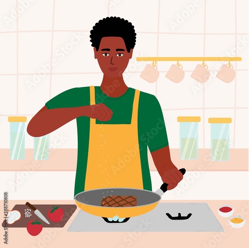 African black man cooking in his kitchen. male in a red shirt and green apron roasting a steak in a frying pan. salt in hand. Cartoon vector illustration