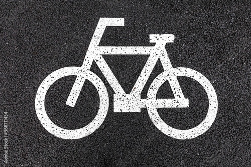 Close - up White bicycle parking sign on asphalt