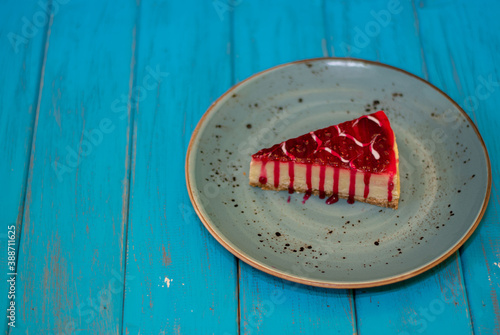 Cake in blue porcelain plate, raspberry chheschake 