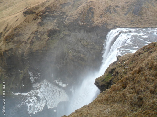 Hiking in the wild and dramatic nature among volcanoes, geysers, waterfalls, snowy mountains and hot springs in Iceland