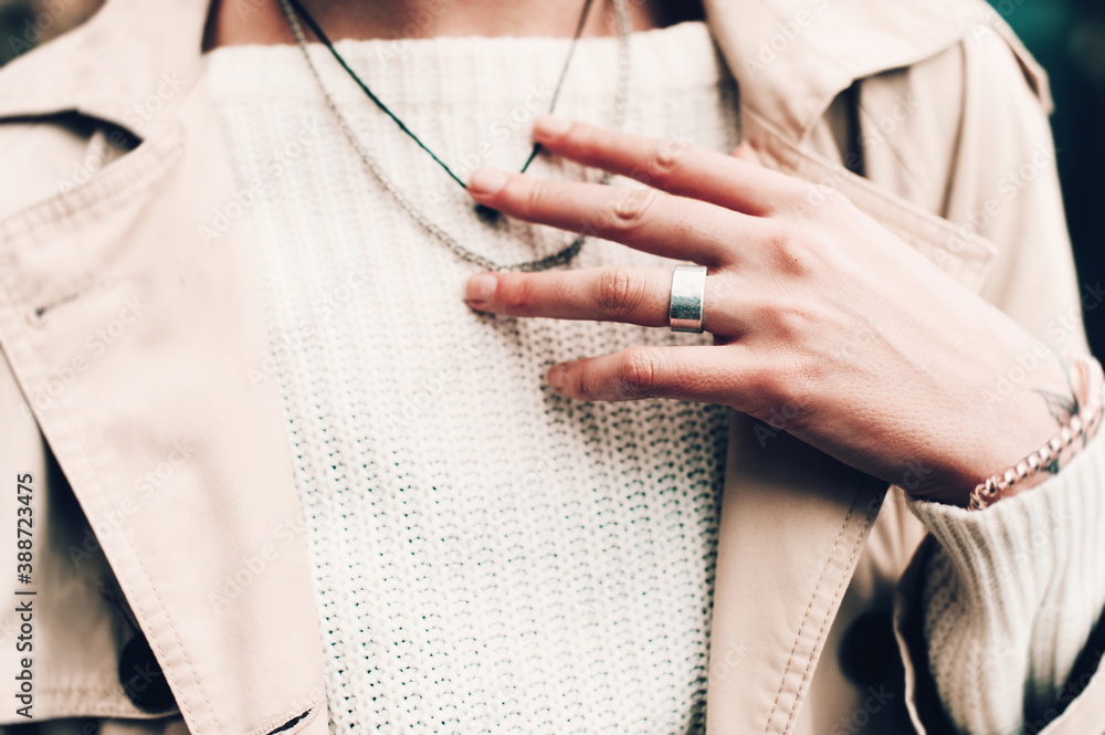 Fototapeta premium Close-up portrait Beautiful elegant woman wearing beige coat and black hat. Trendy casual outfit. Soft selective focus. grain