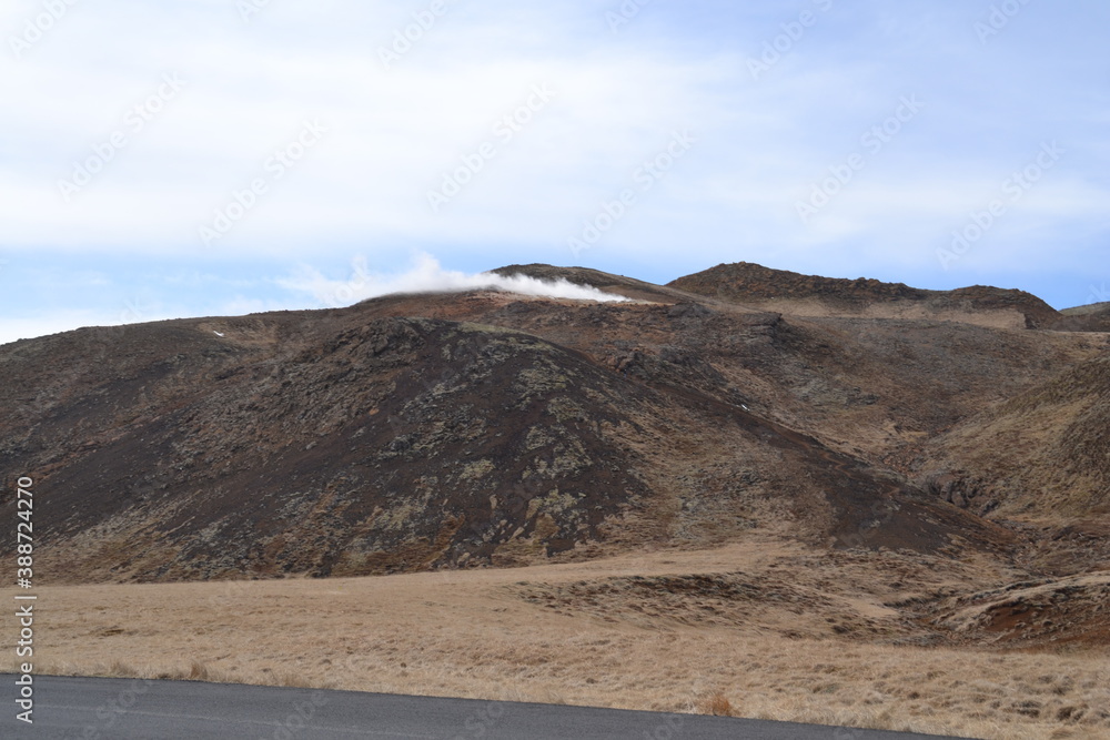 Fototapeta premium The wild and dramatic landscapes of Iceland with mountains, volcanoes, snow, geysers, waterfalls and hot springs