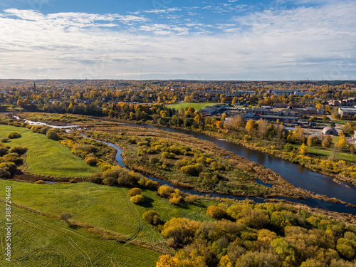 Areal drone autumn photography with view over river Venta.