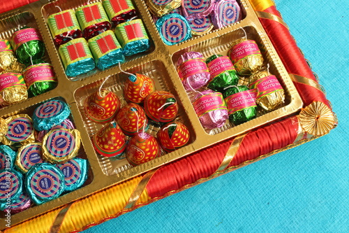 Diwali celebration with fire crackers shaped homemade chocolates inside a gift box