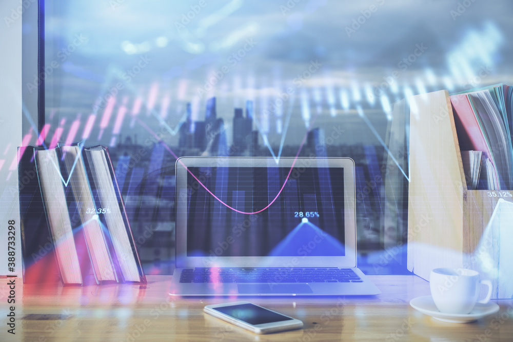 Forex market chart hologram and personal computer background. Multi exposure. Concept of investment. Forex market chart hologram and personal computer background. Multi exposure. Concept of investment.