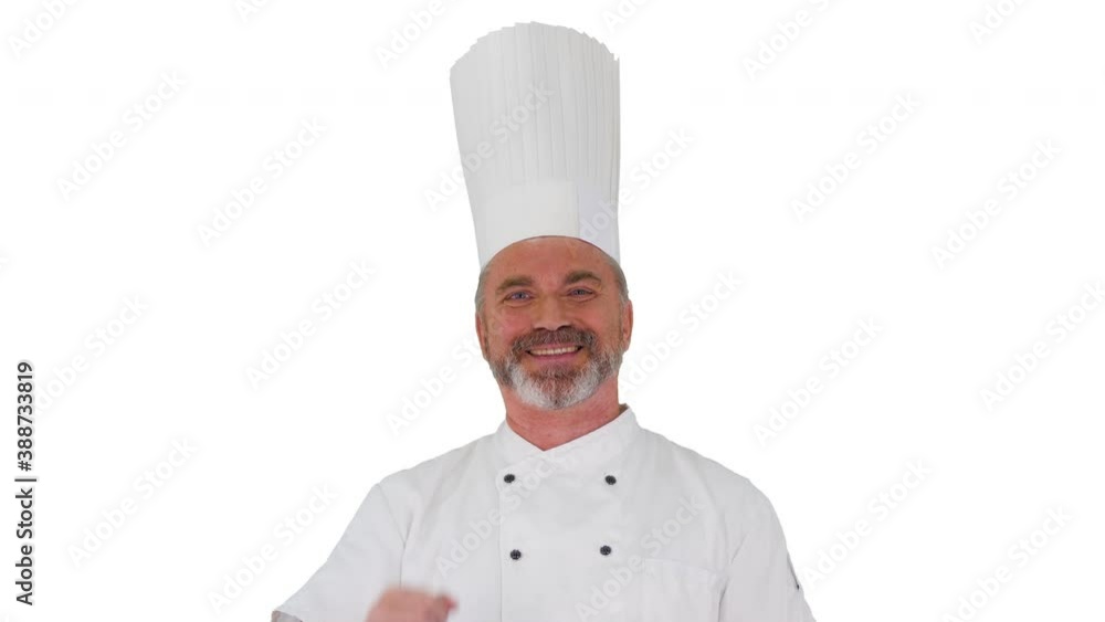 Male chef making real jam gesture to camera on white background. Male chef making real jam gesture to camera on white background.