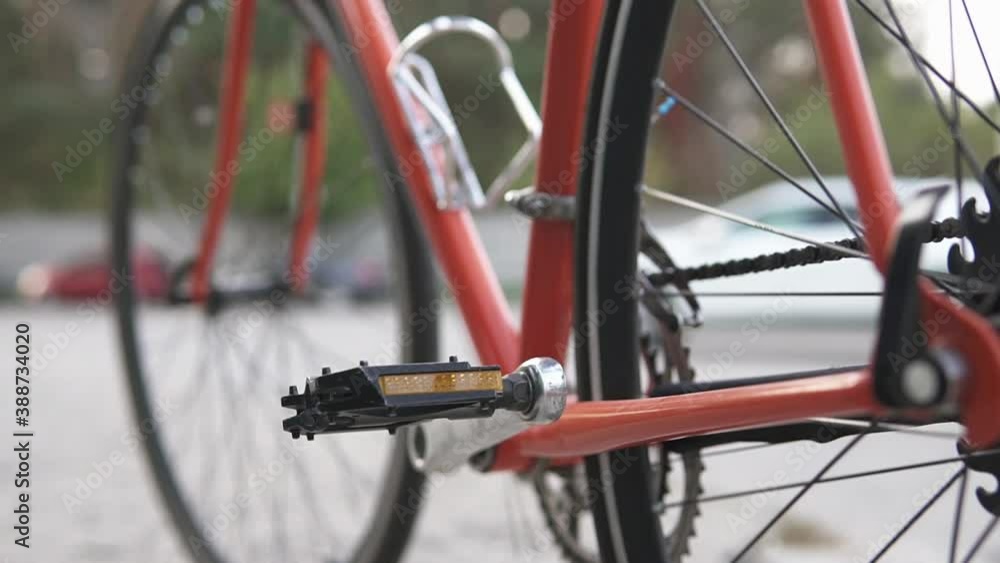 Close up of mechanical parts of a road bike. The hipster is heading to the city center with his bike. Close up of mechanical parts of a road bike. The hipster is heading to the city center with his bike.