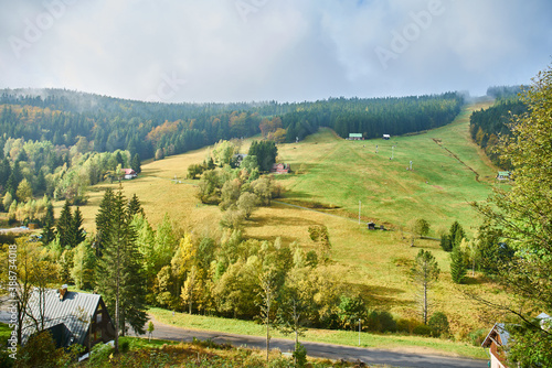  Sunlit hilly pasture during autumn 