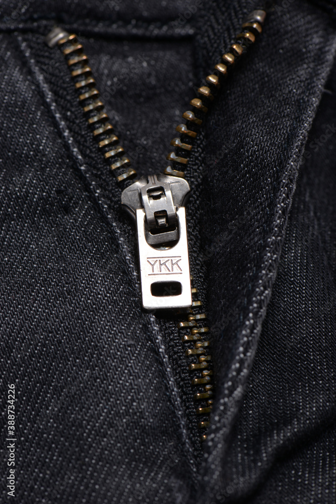 Milan, Italy - February 14, 2017: Closeup of Ykk brand zip from Ck jeans  foto de Stock | Adobe Stock