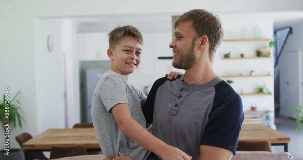 Caucasian man spending time with his son together Caucasian man spending time with his son together