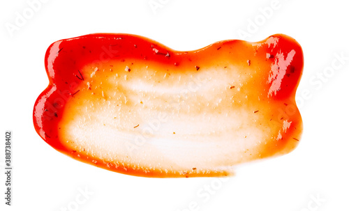 Drop of barbecue sauce or ketchup isolated on white background, top view, close up. Free copy space for text.