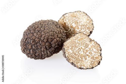 Black truffle and slices isolated on white, clipping path included