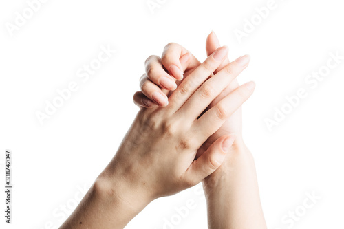 Beautiful hands applying cream, massaging isolated