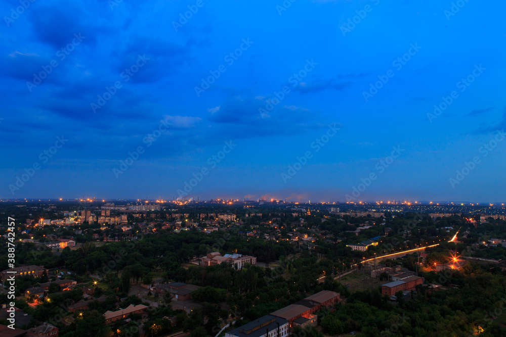Panorama of the evening big industrial city in Eastern Europe