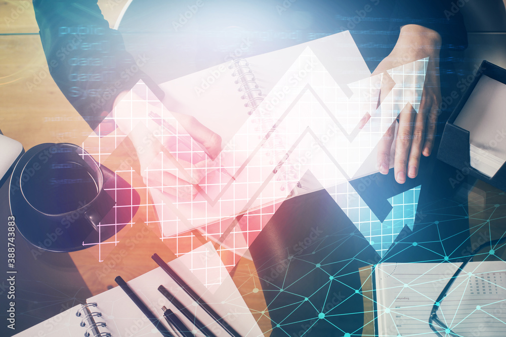 Blue arrow over woman's hands taking notes background. Concept of success. Double exposure Blue arrow over woman's hands taking notes background. Concept of success. Double exposure