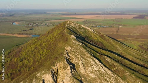 The remain of the reef of the ancient sea composed of limestone - shikhan Yuraktau. Aerial view. photo