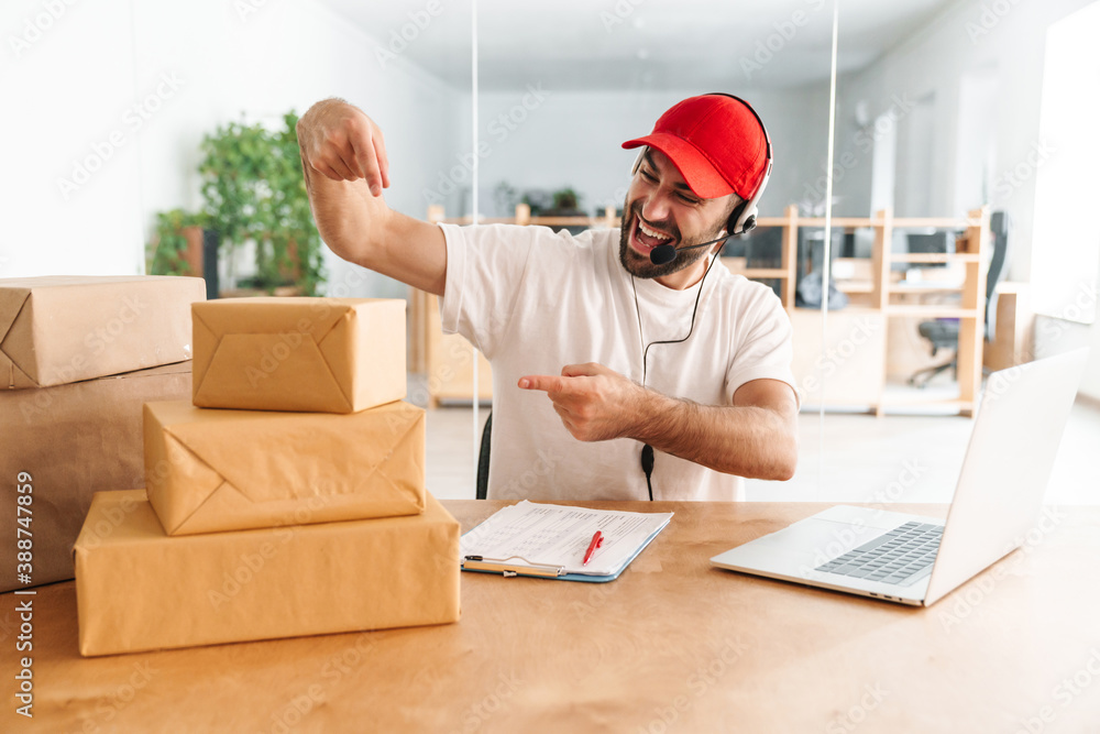 Happy call center worker at parcel distribution center Happy call center worker at parcel distribution center