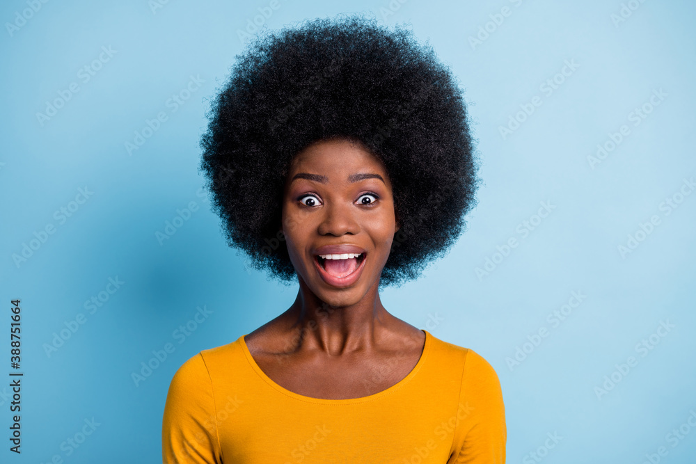 Photo of charming surprised lady staring camera open mouth wear yellow shirt isolated blue color background Photo of charming surprised lady staring camera open mouth wear yellow shirt isolated blue color background