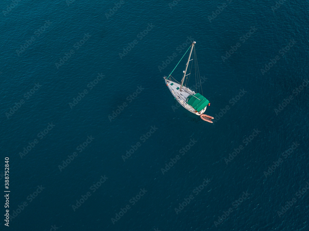Aerial view of boats moored in the Atlantic Ocean at the jagged shores and beaches of Lanzarote, Spain, Canary Islands Aerial view of boats moored in the Atlantic Ocean at the jagged shores and beaches of Lanzarote, Spain, Canary Islands