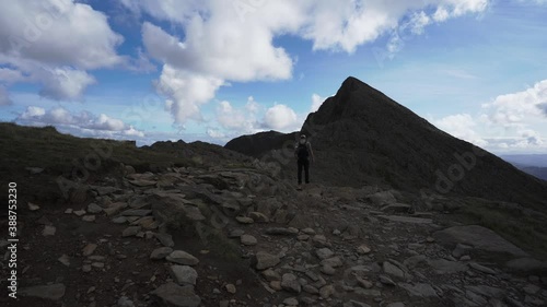 A man walking towards Y Lliwedd mountain in Snowdonia National Park photo