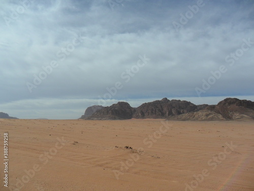 Hiking in the red desert sandcliffs and dunes of Wadi Rum in Jordan  Middle East