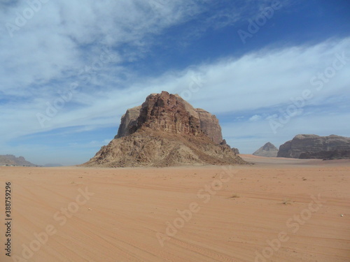 Hiking in the red desert sandcliffs and dunes of Wadi Rum in Jordan, Middle East © ChrisOvergaard