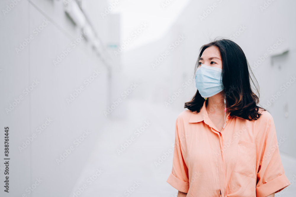 Asian women in protective sterile medical mask,Air pollution, virus, coronavirus concept Asian women in protective sterile medical mask,Air pollution, virus, coronavirus concept