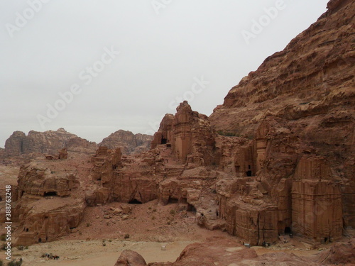 Hiking in the red sand dunes and cliffs of Wadi Rum and Petra archeological site in Jordan, Middle East photo