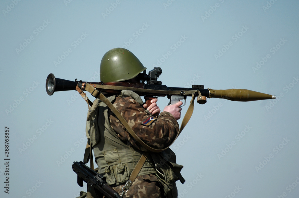 Fototapeta premium Soldier with antitank grenade launcher and flag of Artsakh and also known as Nagorno-Karabakh Republic on military uniform. Collage.