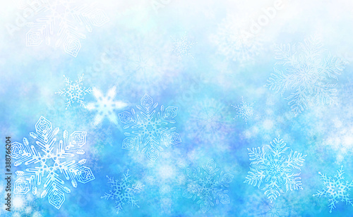 雪の結晶が舞う青い冬の背景
