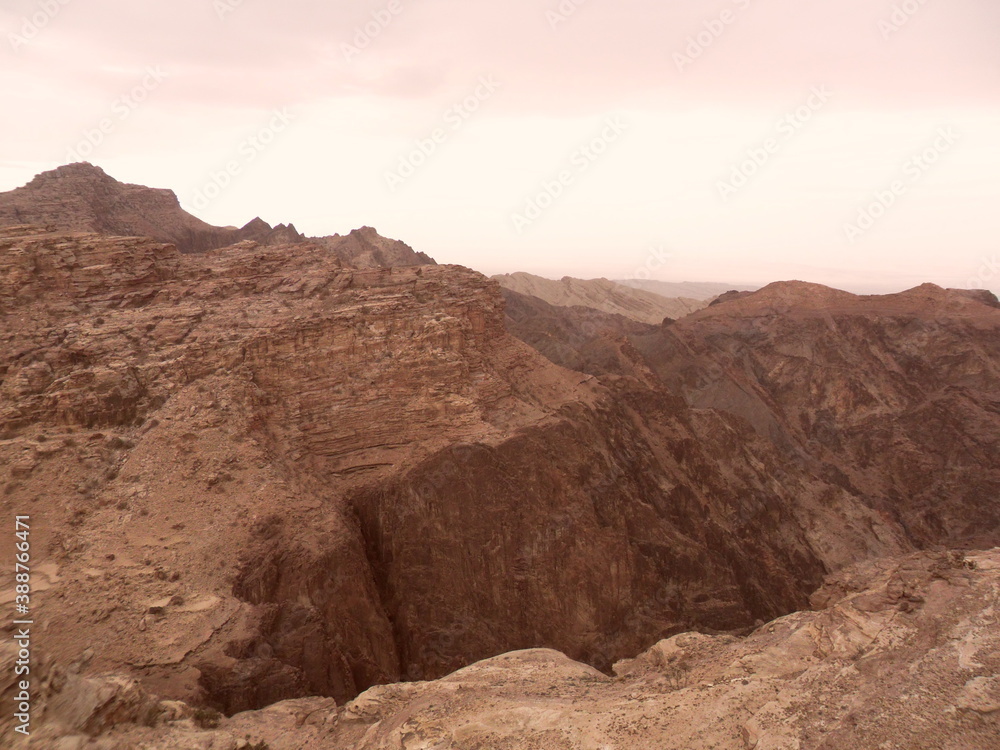Exploring the archeological site of Petra and the red sandstone landscapes in Jordan Exploring the archeological site of Petra and the red sandstone landscapes in Jordan