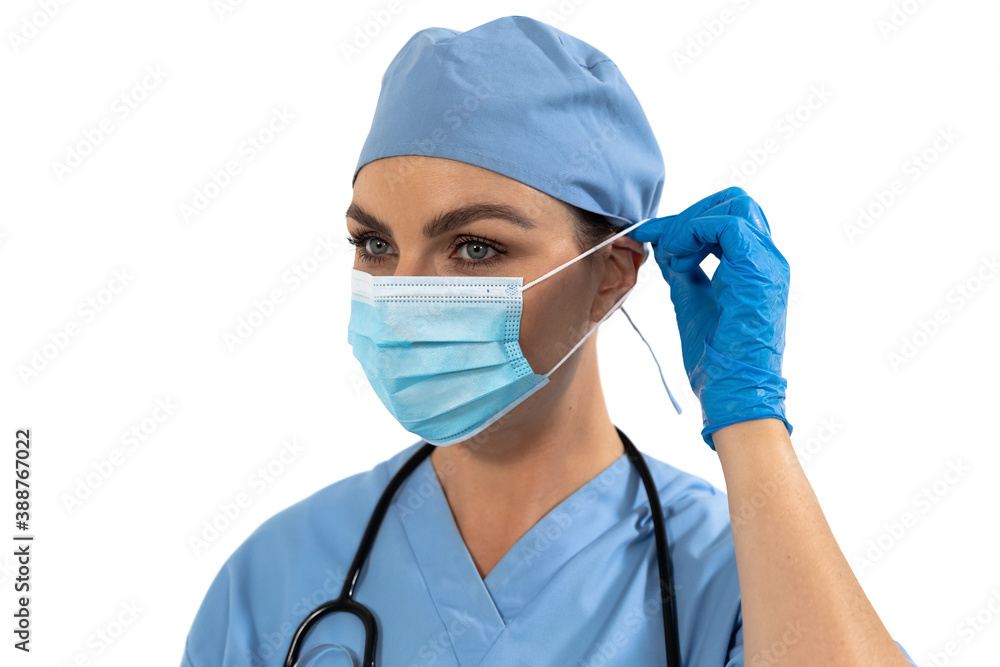Female surgeon wearing face mask against white background Female surgeon wearing face mask against white background