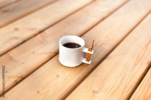 White coffee cup on wood. Weiße Tasse auf Holz.