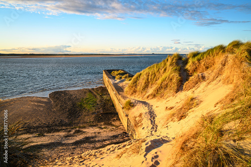 Dunes and Landing Stage at Budle Bay  where the mudflats at high tide are covered which are part of Lindisfarne Nature reserve on Northumberland s AONB coastline