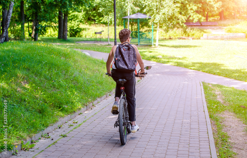 Fototapeta premium Cyclist ride on the bike path in the city Park 