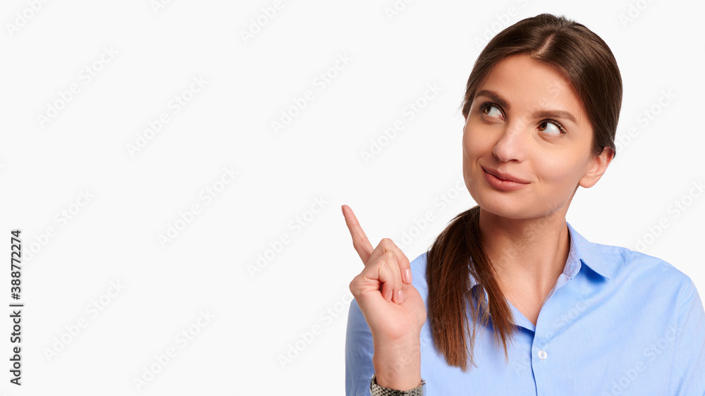 Young businesswoman in uniform and blue shirt showing finger gesture on white isolated background Young businesswoman in uniform and blue shirt showing finger gesture on white isolated background