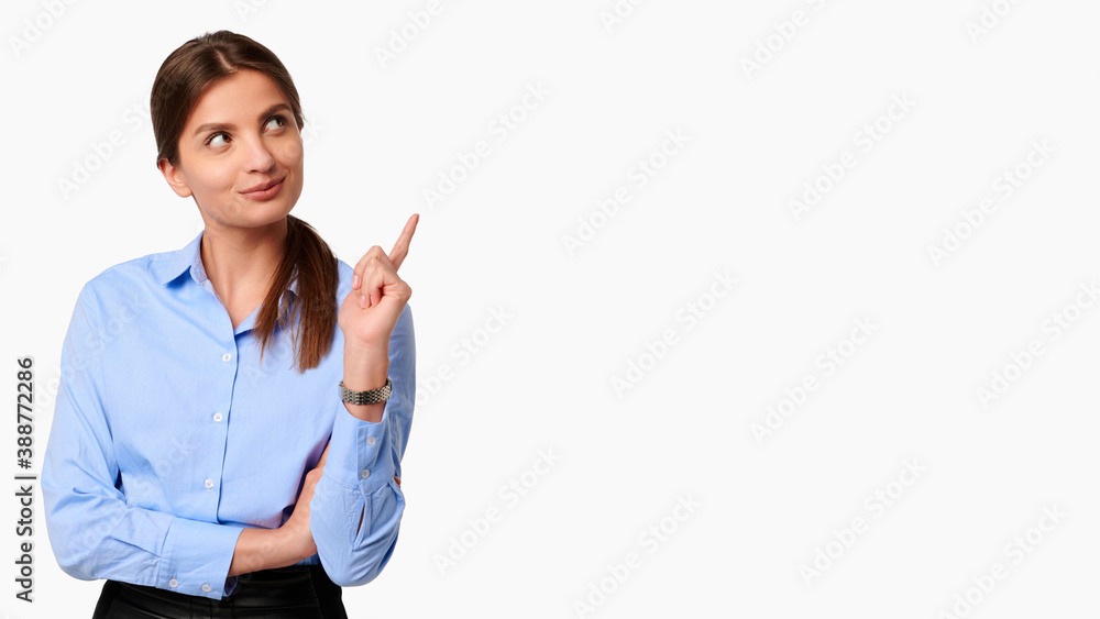Young businesswoman in uniform and blue shirt showing finger gesture on white isolated background Young businesswoman in uniform and blue shirt showing finger gesture on white isolated background