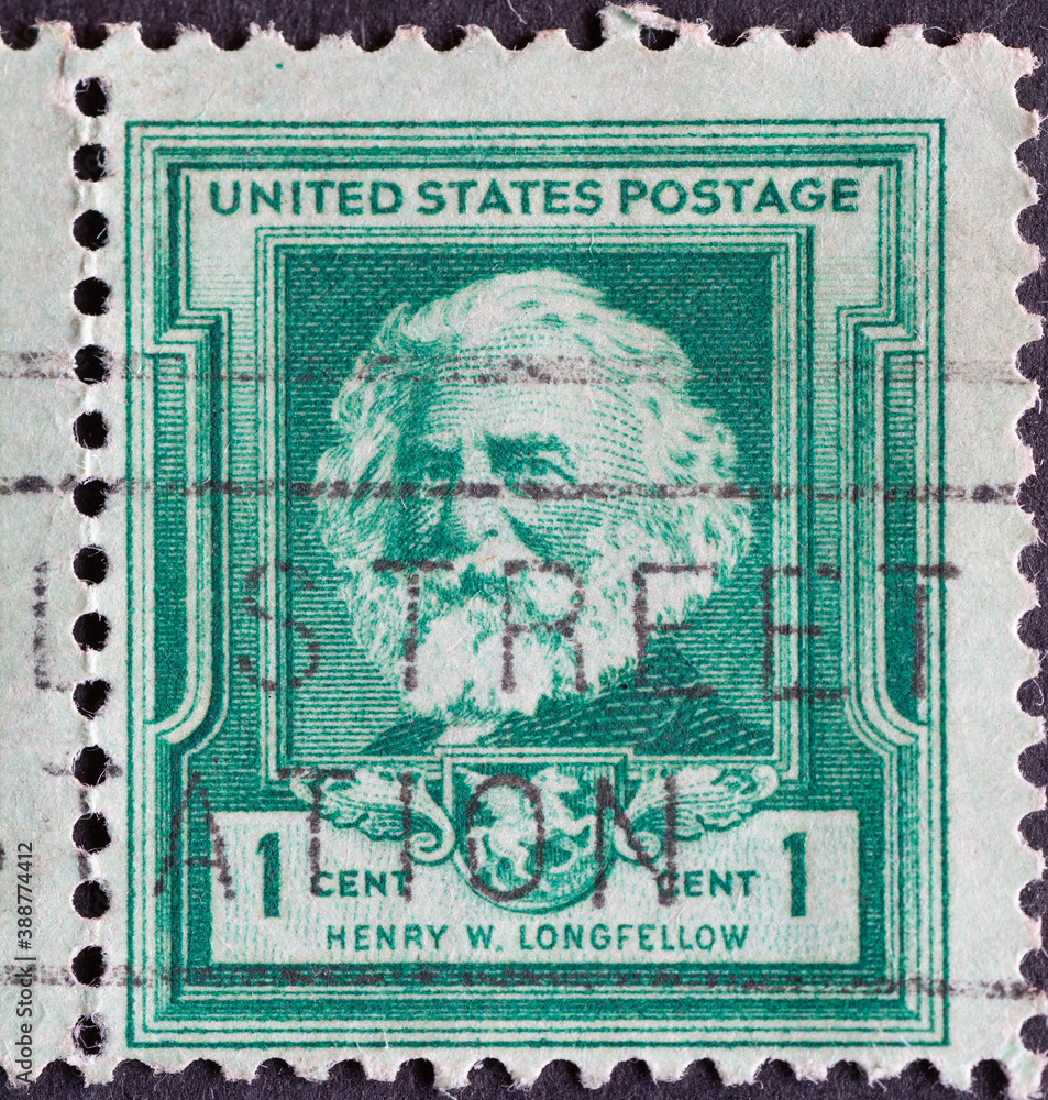 USA - Circa 1940: a postage stamp printed in the US showing a portrait of the American writer, poet, translator and playwright Henry Wadsworth Longfellow
